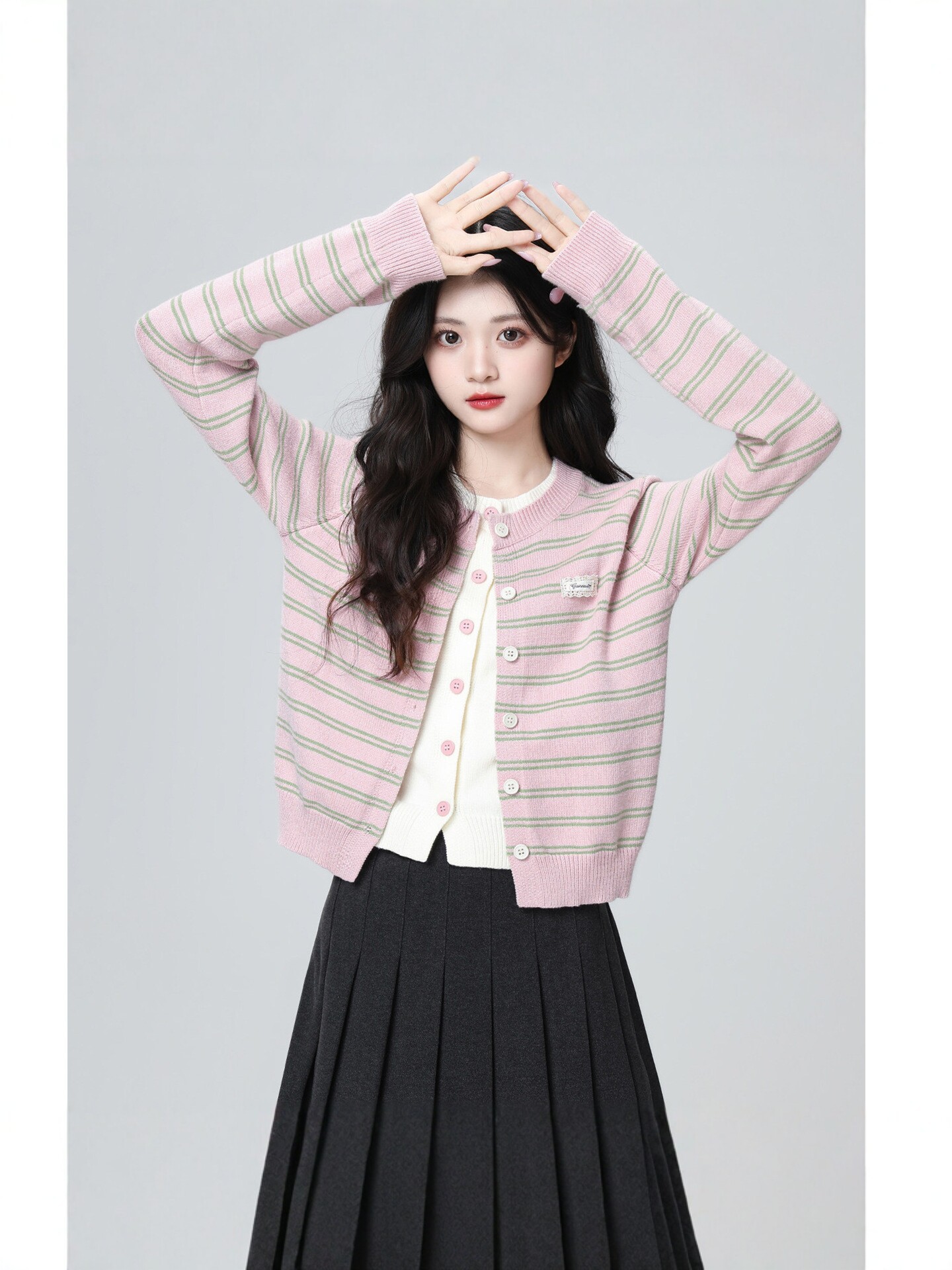 Striped cardigan with a faux layered hem